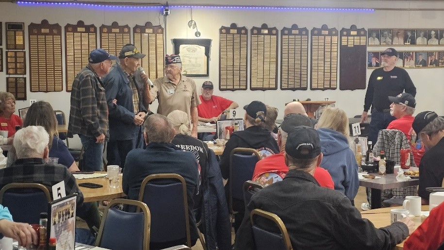 A group of people in a room  AI-generated content may be incorrect.